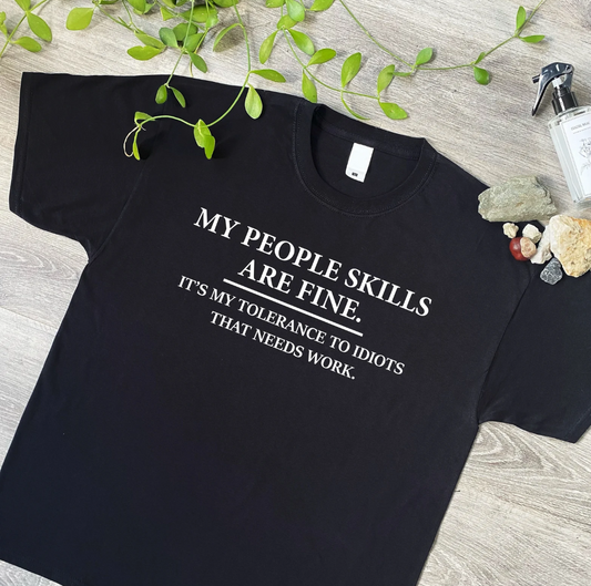 Our "My People Skills Are Fine, It's My Tolerance to Idiots That Needs Work" T-shirt is the perfect way to showcase your sarcastic sense of humor! Made from soft, premium cotton, this funny tee combines comfort and wit, making it ideal for casual wear or as a humorous gift. Whether you're looking to make people laugh or just keep it real, this bold statement shirt is sure to turn heads and spark conversations. Great for anyone who appreciates a touch of sarcasm in their wardrobe!