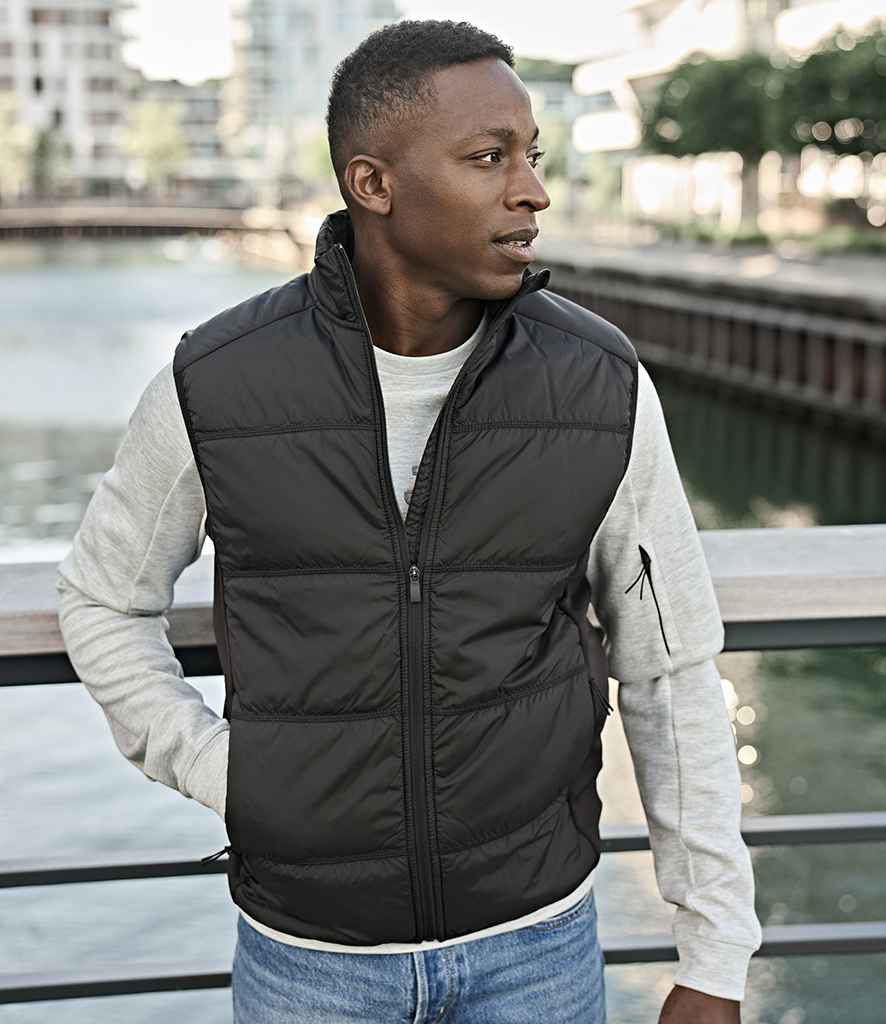 Tee Jays Hybrid-Stretch Bodywarmer | Deep Green/Black