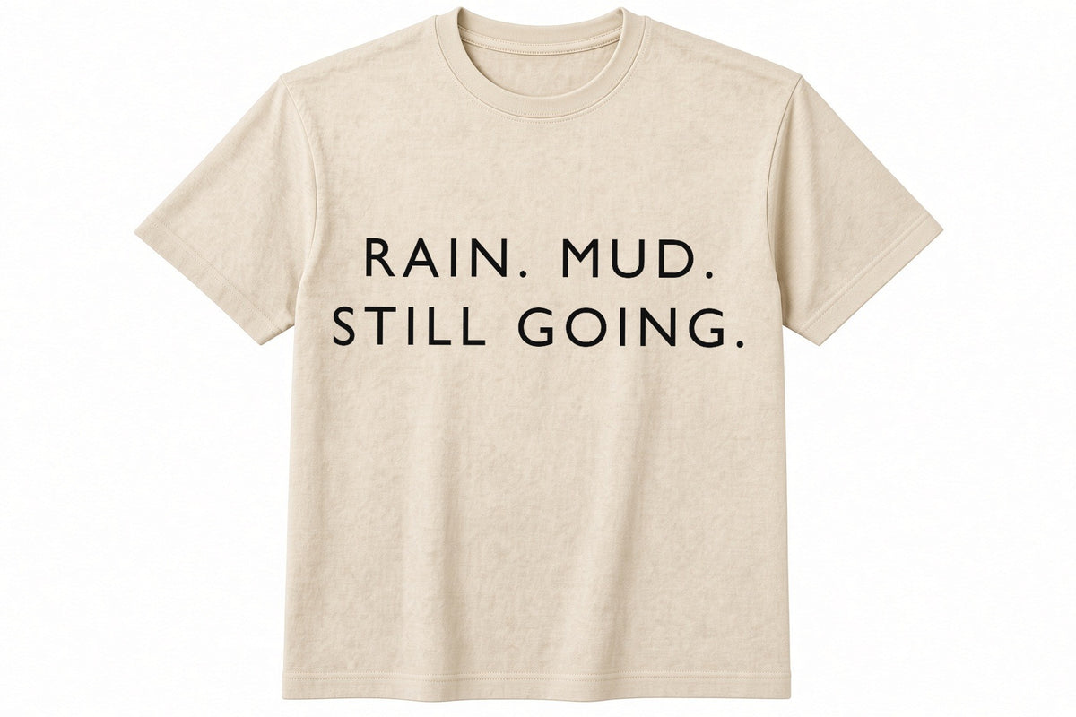 Rain. Mud. Still Going. funny football design on natural t-shirt