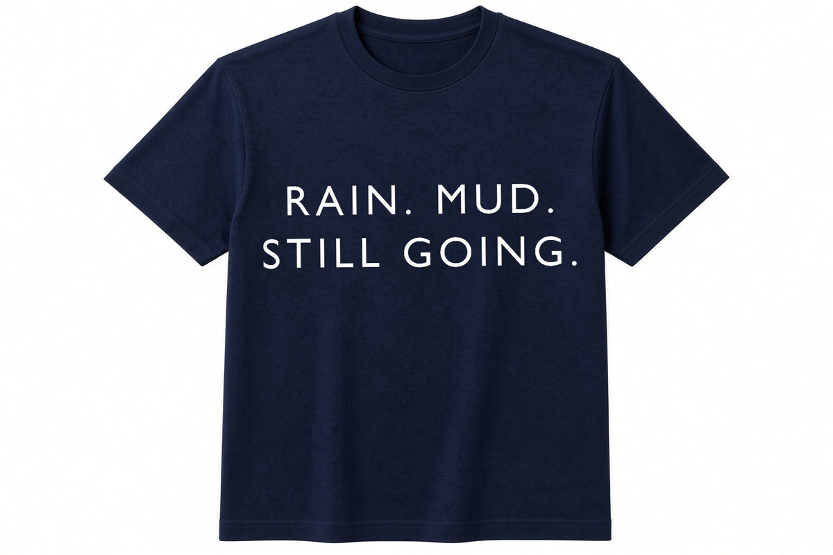 Rain. Mud. Still Going. funny football design on navy t-shirt