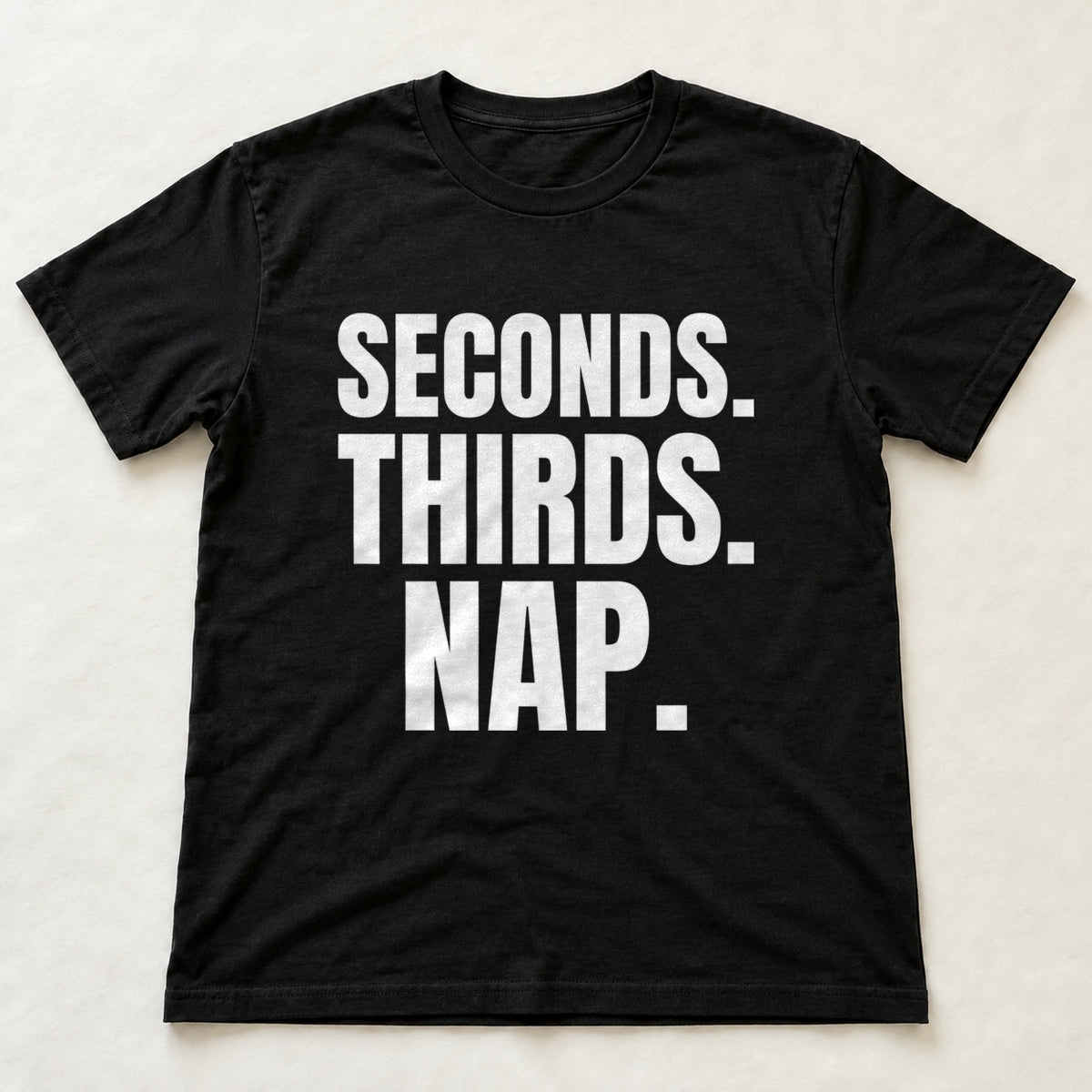 Seconds. Thirds. Nap. black t-shirt flat lay