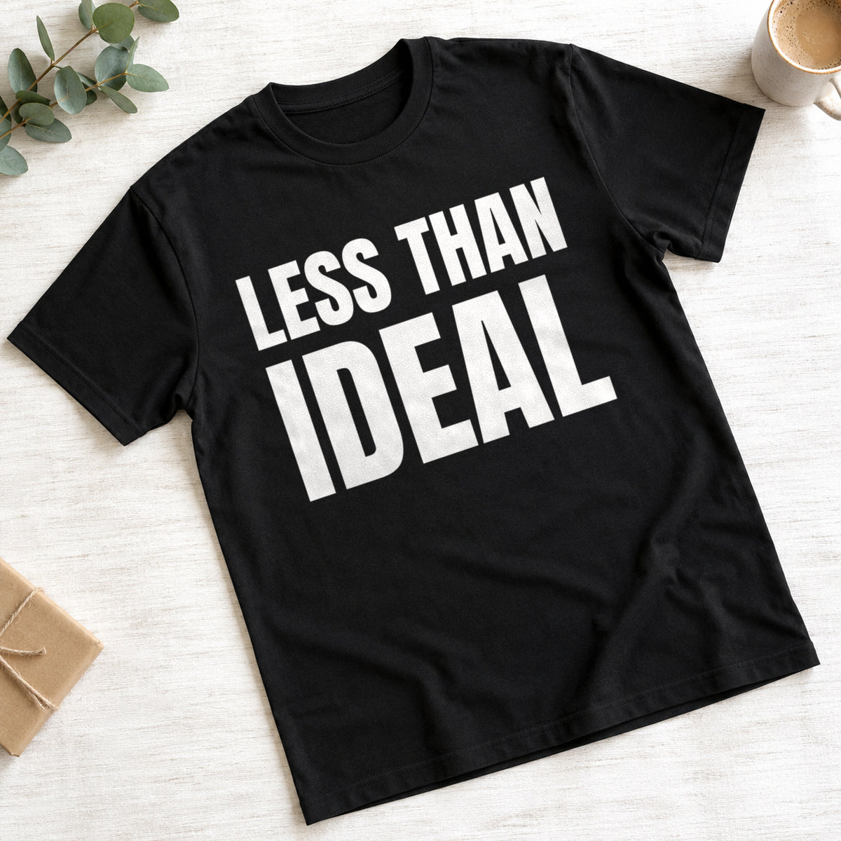 Less Than Ideal funny slogan on a black t-shirt