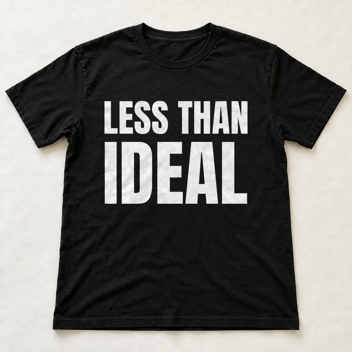 Less Than Ideal black t-shirt flat lay