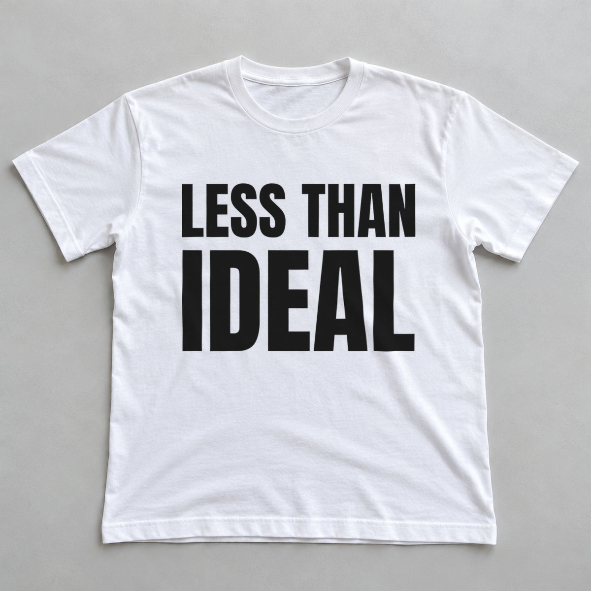 Less Than Ideal white t-shirt flat lay