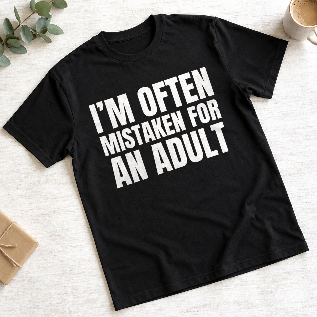 I'm Often Mistaken For An Adult funny slogan on a black t-shirt