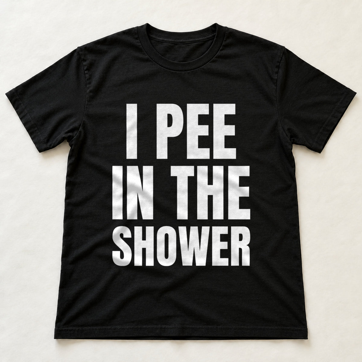 I Pee In The Shower black t-shirt flat lay