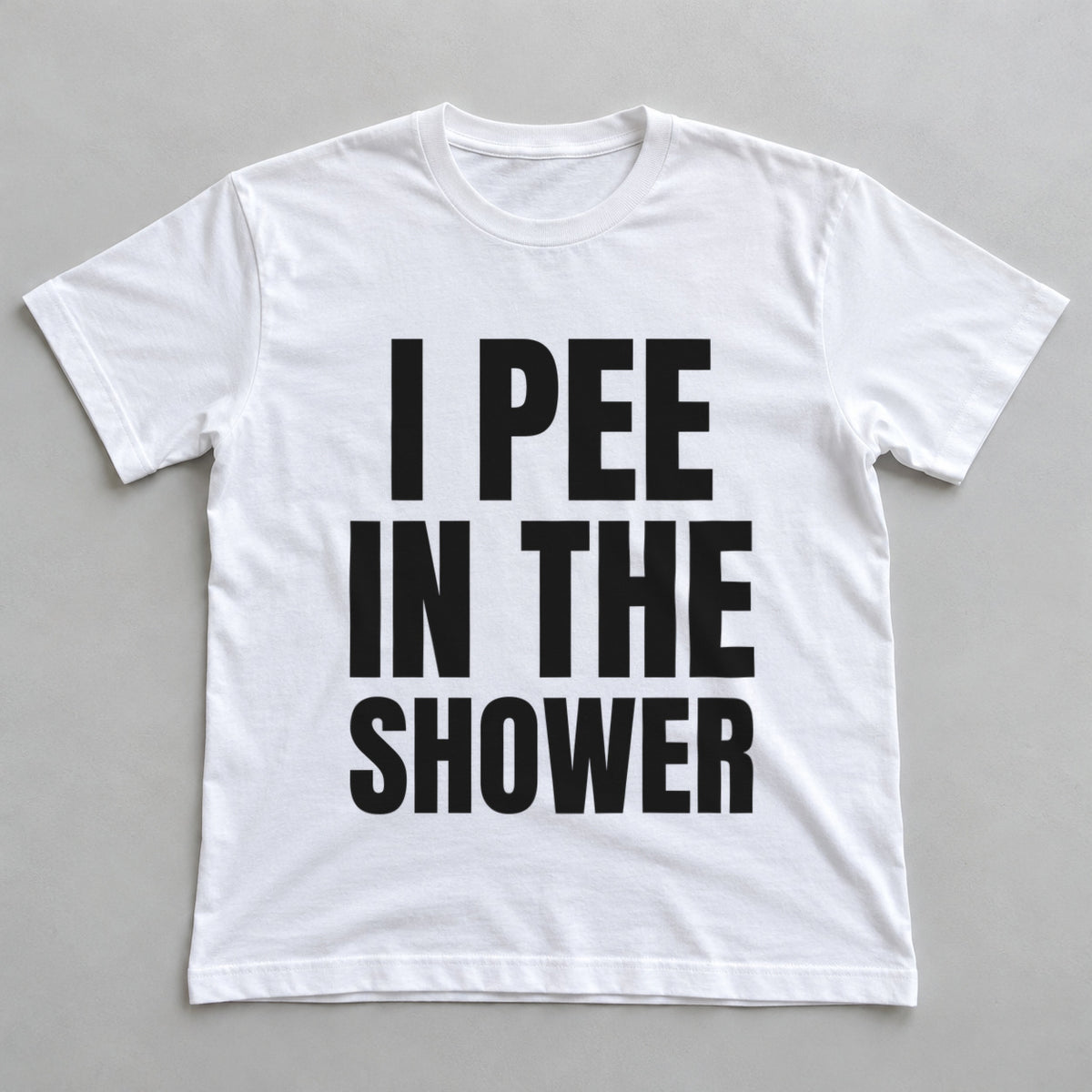 I Pee In The Shower white t-shirt flat lay