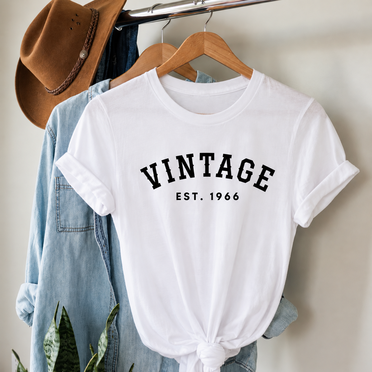 White personalised Vintage EST. 1966 birthday T-shirt on a hanger